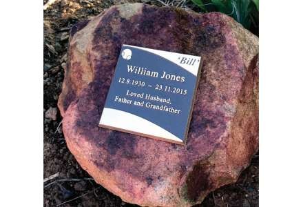 Plaque on rock display