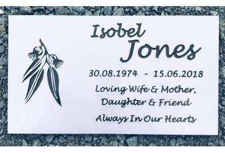 White plaque with inverted black font